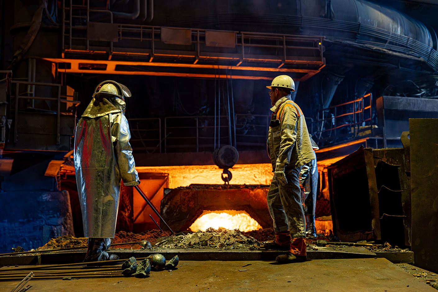 The final tap from Blast Furnace A Photo of two employees in front of Blast Furnace A during the final tap